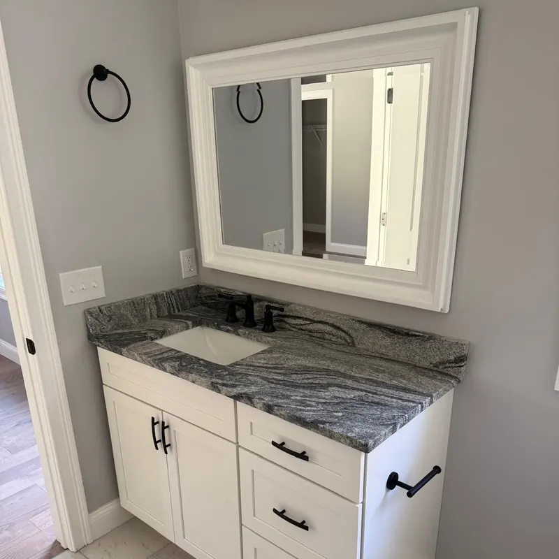 Stone vanity top, white cabinetry