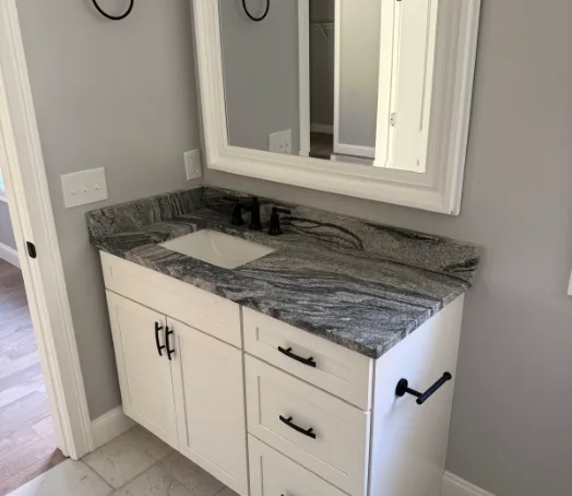 Granite vanity, dark hardware