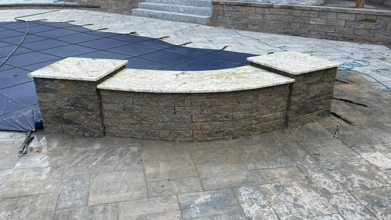 Granite pool coping & curved stone wall cap