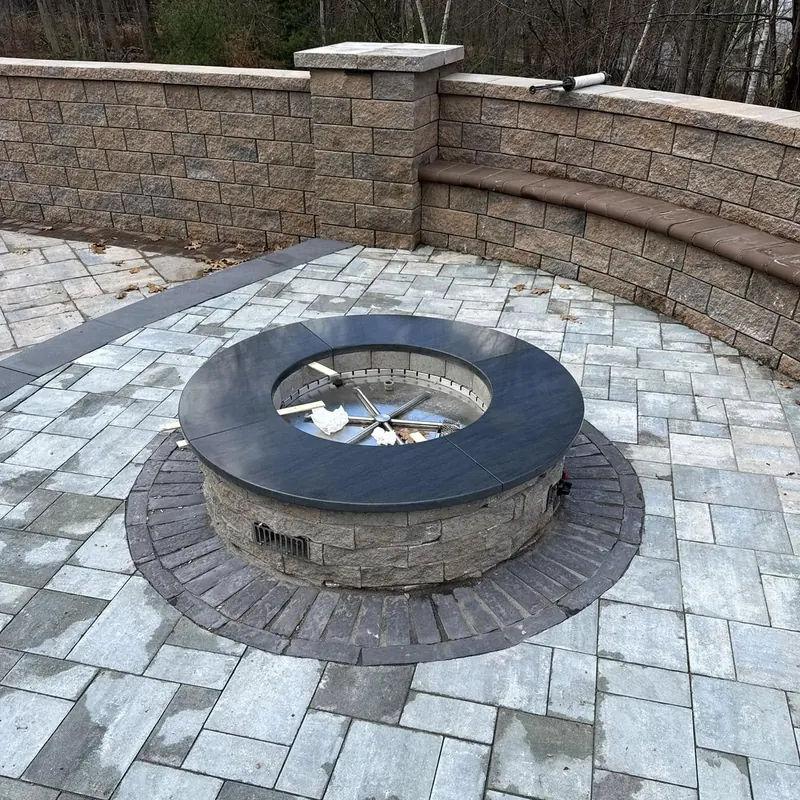 Outdoor fire pit with granite cap