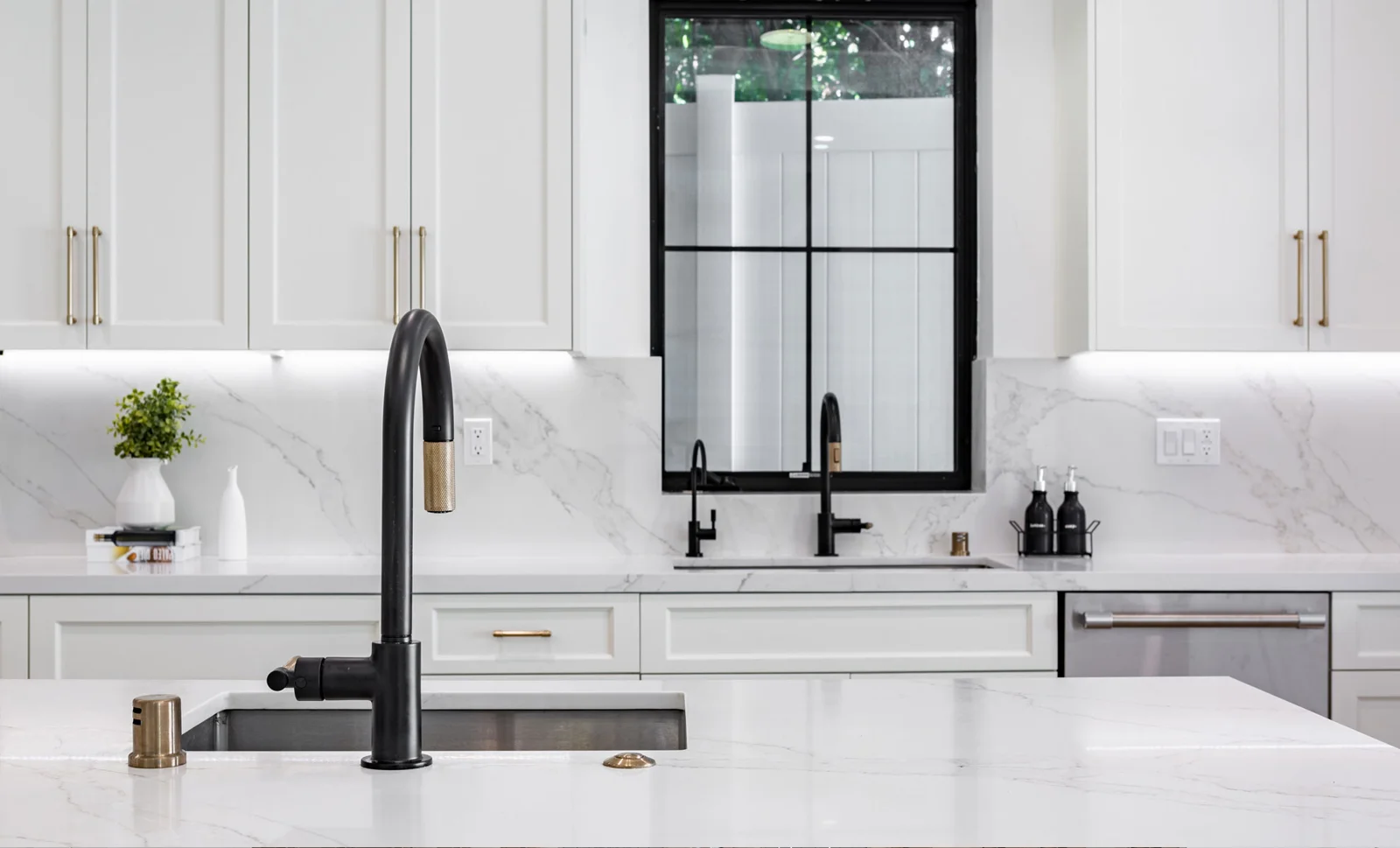 Vadara marble-look island with matte black fixtures